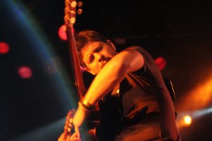 Rodrigo plays guitar on stage at a Rodrigo y Gabriela Concert in Barcelona, Spain.